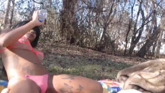Fake tits ebony camgirl smoking outdoors in bikini